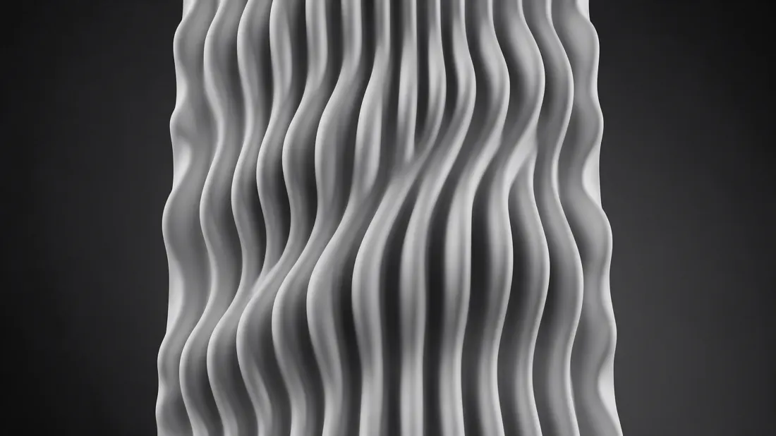 Surface sculptée de vagues verticales grises, en noir et blanc